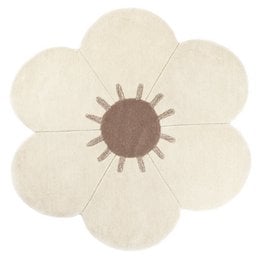 A round, white children's rug with a large daisy flower design in the center. The rug has a soft, plush texture and appears to be made of a natural fiber material.