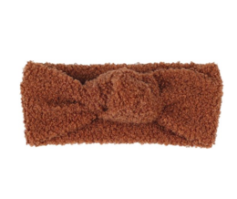 A brown fuzzy headband with a bow design, suitable for children.