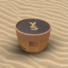Eco-friendly interior cleaning tabs in a cylindrical container with a blue and yellow label. The container is made of cardboard and has a simple, minimalist design.