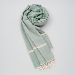 Soft, handwoven cotton scarf in a light green color with small white stripes along the borders.