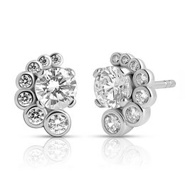  Silver-toned stud earrings featuring a round central diamond-like stone surrounded by smaller diamond-like stones in a floral arrangement.