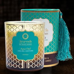 Aqua-colored scented candle in a glass container with a decorative gold and teal pattern. The candle is described as a "Song of India - Pitta aqua oud ayurveda scented candle with 1 wick in glass - 200 g" and is categorized as a "Cream" product.