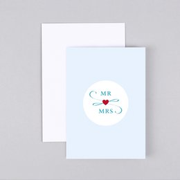A wedding card with the text "Mr & Mrs" and a heart icon, printed on a white card with a beige envelope.