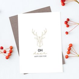 A Christmas card with a minimalist design featuring a white deer silhouette against a gray background and the text "Oh deer, happy new year".