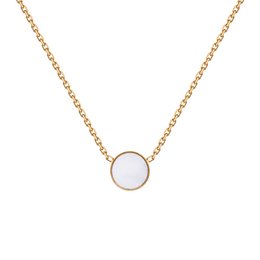 Delicate gold necklace with a single white opal stone pendant.