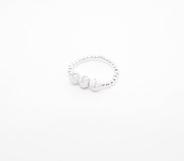 White and gray howlite ring with a minimalist, stackable design. Available in small, medium, and large sizes in plaqué, gold filled, or sterling silver 925 finishes.
