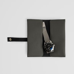 Minimalist grey leather watch roll case. Leather case for watches in black, brown, and grey colors.