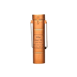  Copper-coloured metal wine bottle holder, cylindrical shape with handle, engraved text detail, elegant design.