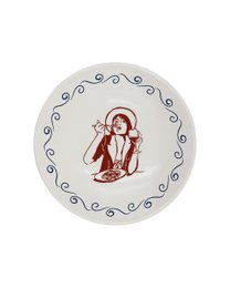  A round, white dinner plate with a green scalloped edge and a green illustration of a person in a relaxed, vacation-inspired pose.
