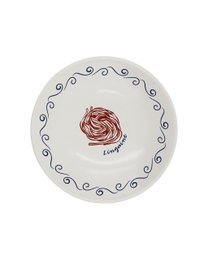  A round, white dinner plate with a green scalloped edge and a green illustration of a person in a relaxed, vacation-inspired pose.