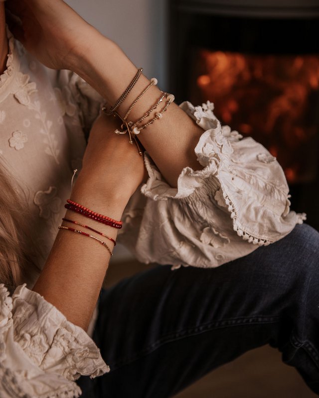 gold bracelet with red