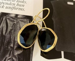 Oorbellen cateye steen zwart