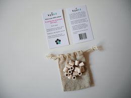 Zakje met 15 EM® roze keramische kralen