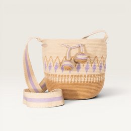 Woven straw crossbody bag with geometric lilac pattern, natural tan color, adjustable strap.
