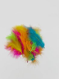 Neon colorful marabou feathers, vibrant rainbow colors, fluffy feather decoration, festive party accessory