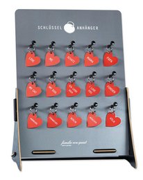 Red heart-shaped key fobs with black metal accents.