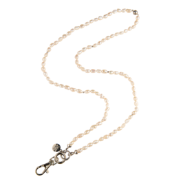 A delicate pearl necklace with a metal clasp, suitable for children as a keychain accessory.
