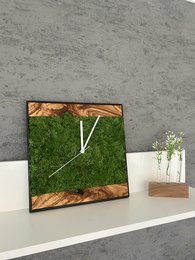 Rustic wall clock with olive wood frame and moss accents, creating a natural, earthy aesthetic for wall decor.