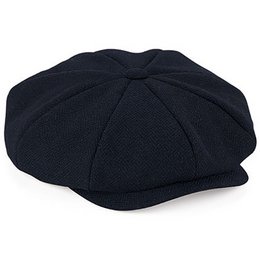A navy blue flat cap made of wool. The cap has a classic 8-panel design and is available in sizes L/XL and S/M.