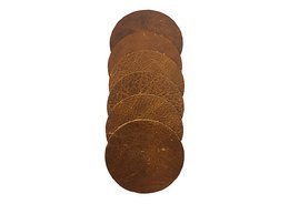 Set of round coasters in cognac, black, and light gray colors made of natural materials.