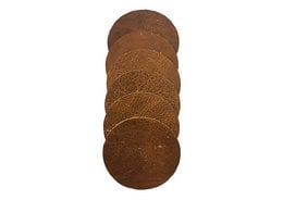 Set of round coasters in cognac, black, and light gray colors made of natural materials.