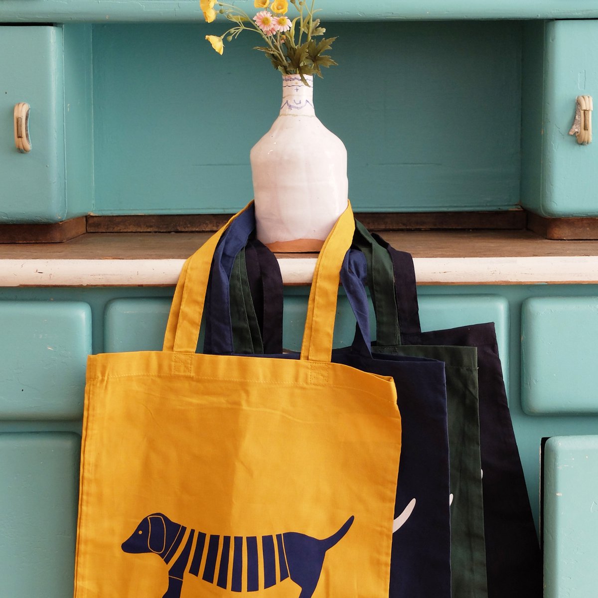 hand-printed fabric bag with green dachshund motif