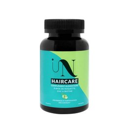 Gummies for hair growth, containing natural ingredients to support healthy hair. Bottle with green and black label.
