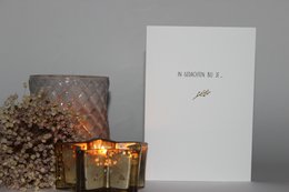 A greeting card with the text "Silence In mind with you..." on a white background, accompanied by decorative candles and flowers.