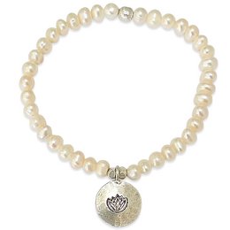 A single-strand freshwater pearl bracelet with a silver lotus charm. The pearls are in a natural, creamy white color and the charm features a lotus design.