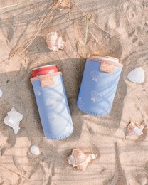 Blue can sleeve with coral red and tan leather accents, minimalist design, insulated drink holder.