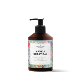 Hand soap with a floral design and the text "Have a great day" on the label. The soap is in a bottle with a black pump dispenser.