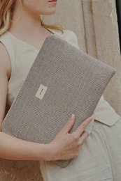 Sleek and stylish laptop sleeve in a neutral gray hue, available in multiple sizes to fit 12/13, 13/14, and 15/16 inch laptops.