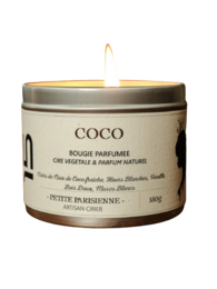 Coconut-scented, round, tall candle in a silver tin container.