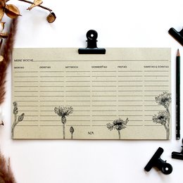 Weekly planner made of grass paper with cornflower design. Includes lined pages for scheduling and planning.