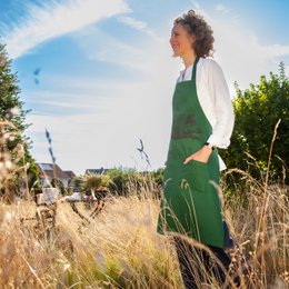 Green cooking apron with wild boar