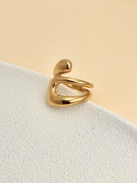 Gouden verstelbare stalen ring met een abstract ontwerp