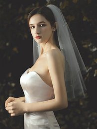 Elegante tweedelige bruidssluier met kleine parels