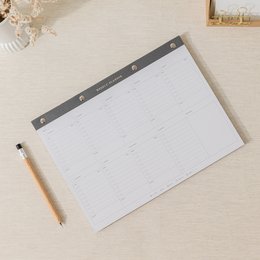 A4 size weekly planner notepad with a minimalist gray and white design, featuring a grid layout for organizing weekly schedules and tasks.