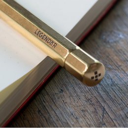 Brass pencil with a twisting mechanism, suitable for writing and sketching.