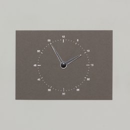 Dark grey clock-themed card with a minimalist analog clock face design.