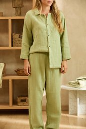 Green muslin pajama set, long sleeves, button-up shirt, comfortable loungewear, earth tone color.