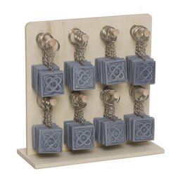 Gray square keychains with a floral design.