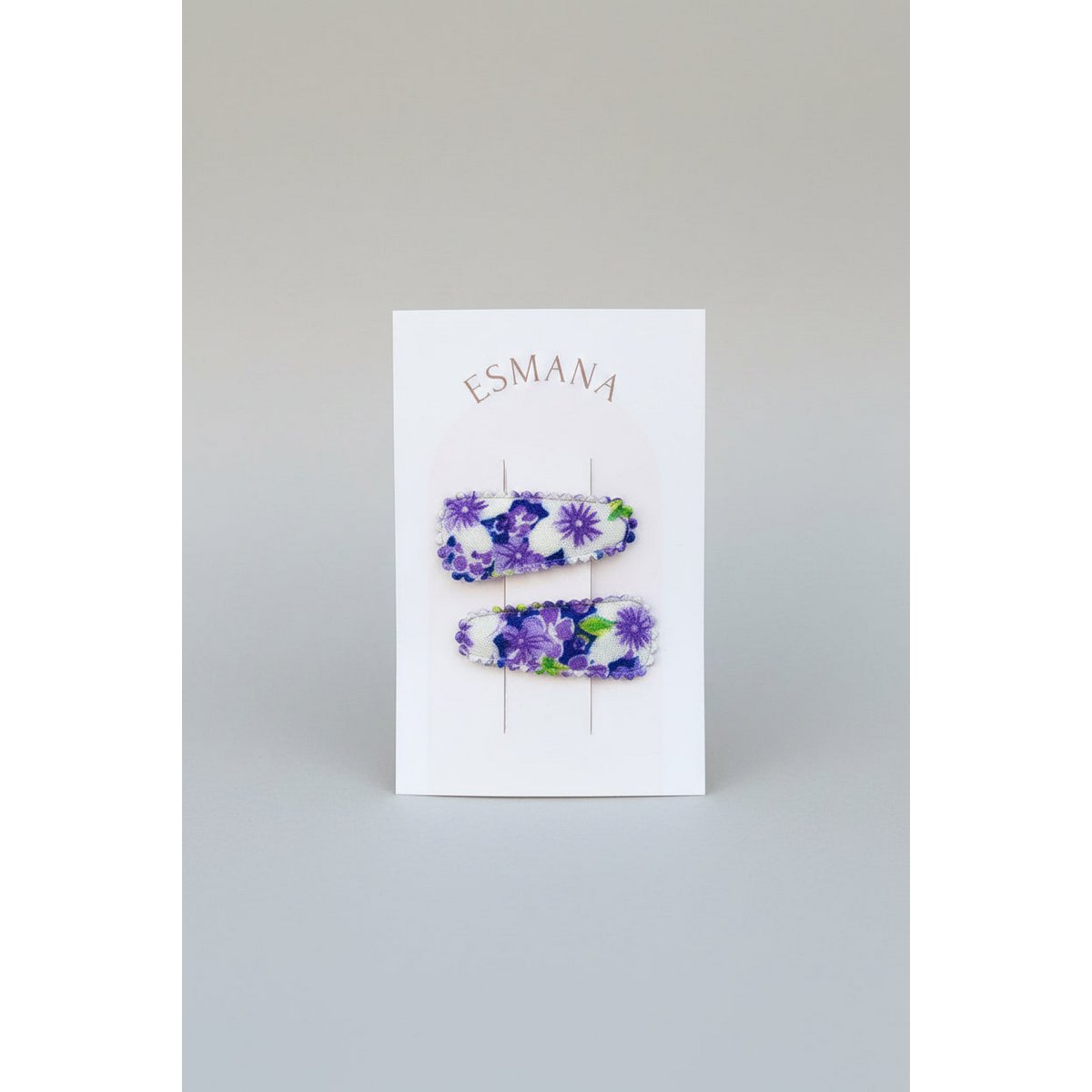 Baby tryknål med lilla blomster