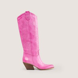 Bright pink suede cowboy boots, tall knee-high western style, pointed toe, chunky heel, flamingo colored women's boots.