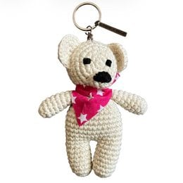 Handcrafted off-white organic cotton bear bag charm, crocheted in Nepal. Soft, plush, and adorable keychain or accessory.