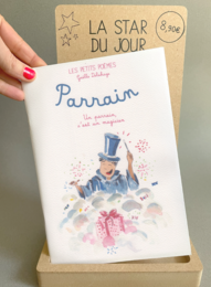  A children's book titled "Parrain" featuring a whimsical illustration of a man in a top hat. The book appears to be a gift for a christening or other special occasion.