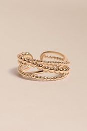 Gold-toned stacked ring with intricate detailing, suitable for layering with other rings.