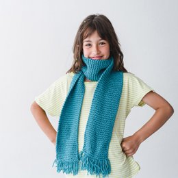 Knitting scarf kit in blue and curry colors, featuring a cozy, textured scarf with fringe.