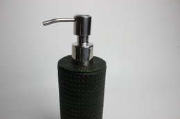 Round soap dispenser in crocodile look-black and stainless steel