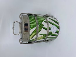 Green leaf patterned stainless steel lunch box with multiple compartments.